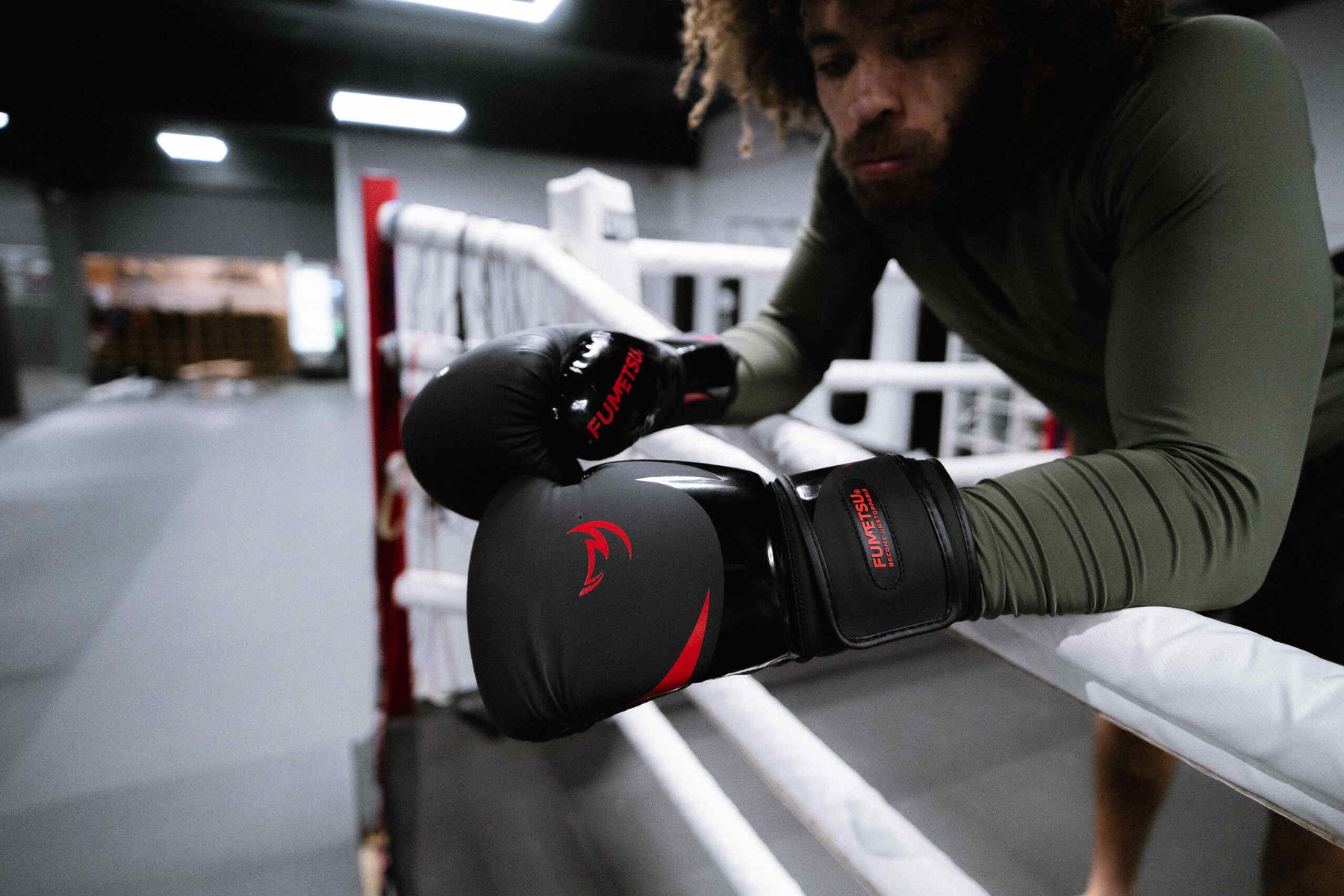 Fumetsu athlete preparing to train in a boxing ring